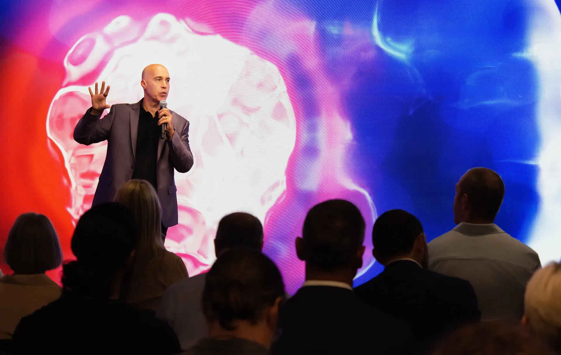 Healthspan Summit speaker on stage addressing the audience